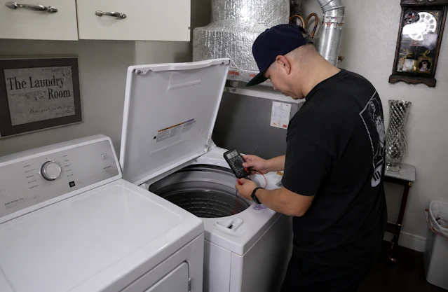 Sargents Appliance Sales and Service technician repairing a washing machine in Reno and Sparks